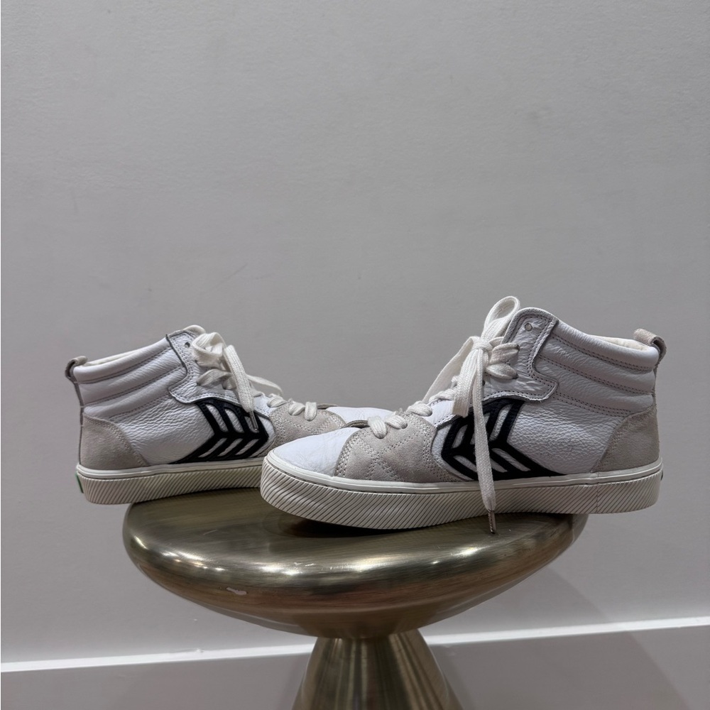 White and Black High-Top Cariuma Sneakers
